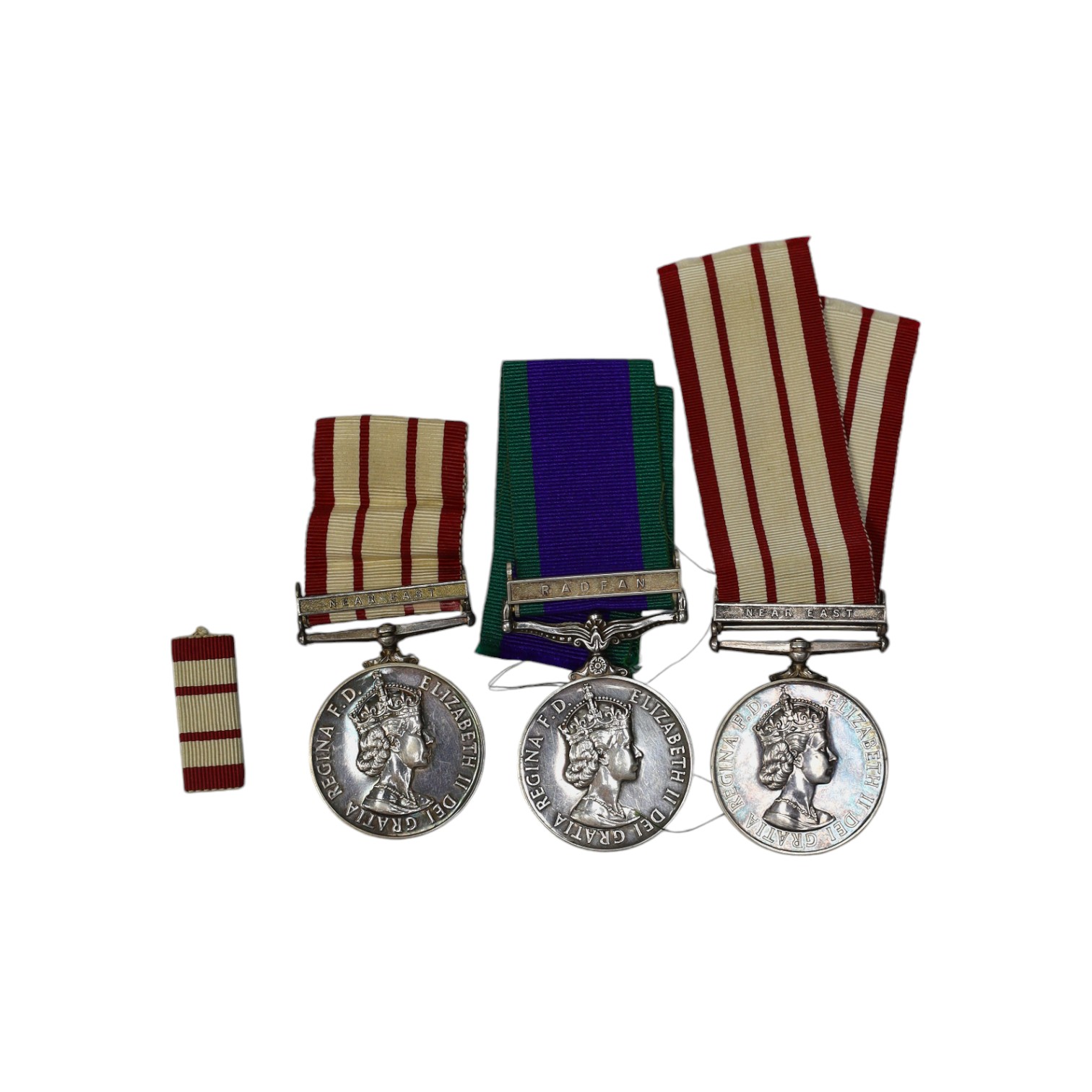 Three ERII Royal Navy medals; a Campaign Service Medal with a bar for Radfan awarded to J. Rush R.E.A.2 R.N., A Naval General Service Medal with a bar for the near East awarded to P/SKX J-C. Shaw M.(E.)1. R.N., plus a se